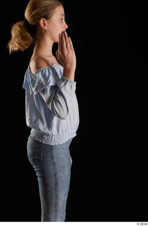 Sarah  1 arm blue blouse dressed flexing side view…